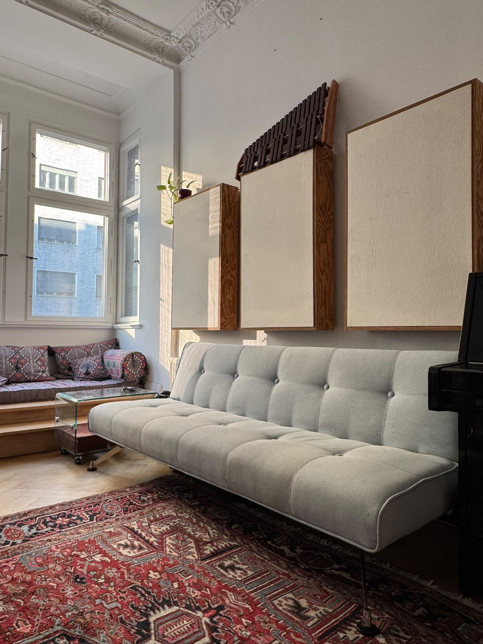 Studio lounge with sofa and acoustic panels